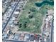 Aerial view of the home with a golf course in the background at 11010 W Acacia Dr, Sun City, AZ 85373