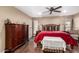 Comfortable bedroom featuring a decorative wooden headboard and lots of natural light at 11010 W Acacia Dr, Sun City, AZ 85373