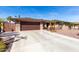 Charming single-story home showcasing a well-maintained front yard, brick accents, and a spacious driveway at 11010 W Acacia Dr, Sun City, AZ 85373