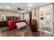 A large main bedroom features a walk-in closet and an ensuite bathroom at 11010 W Acacia Dr, Sun City, AZ 85373