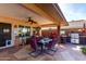 Covered patio for outdoor dining complete with a built in grill at 11010 W Acacia Dr, Sun City, AZ 85373