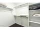 Walk-in closet with adjustable shelving for storing shoes, blankets and clothing at 1130 N 2Nd St # 103, Phoenix, AZ 85004