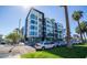 Modern apartment complex with multiple stories, balconies, and palm tree landscaping at 1130 N 2Nd St # 103, Phoenix, AZ 85004