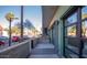 Modern condo building with glass garage door-style openings and landscaped walkway at 1130 N 2Nd St # 103, Phoenix, AZ 85004