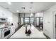 Open concept kitchen with white cabinets, quartz countertops, and stainless appliances at 1130 N 2Nd St # 103, Phoenix, AZ 85004