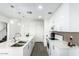 Bright kitchen with white cabinets, quartz counters, and a stainless steel sink at 1130 N 2Nd St # 103, Phoenix, AZ 85004