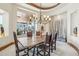 Inviting dining room with rustic wood table, decorative lighting, and scenic views at 12160 E Whispering Wind Dr, Scottsdale, AZ 85255