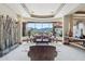 Bright living room with oversized windows offering stunning desert views, creating an inviting space at 12160 E Whispering Wind Dr, Scottsdale, AZ 85255