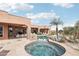 Inviting swimming pool with waterfall feature, set in a beautifully landscaped backyard at 12160 E Whispering Wind Dr, Scottsdale, AZ 85255