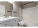 Bathroom with a white vanity, a large mirror, and a shower-tub combination at 1244 W Castle Dr, Casa Grande, AZ 85122