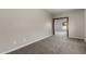 Bedroom featuring neutral walls, carpeted floor, with an open doorway to another room at 1244 W Castle Dr, Casa Grande, AZ 85122