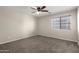 Bedroom with neutral walls and carpet, and large window at 1244 W Castle Dr, Casa Grande, AZ 85122