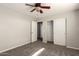 Comfortable bedroom featuring carpeted floors, a closet with sliding doors, and neutral paint at 1244 W Castle Dr, Casa Grande, AZ 85122