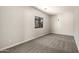 Bedroom with neutral walls, carpeted floor, and a window that provides natural light at 1244 W Castle Dr, Casa Grande, AZ 85122