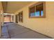 View of the covered patio, featuring a textured wall and concrete pavers for outdoor relaxation and entertainment at 1244 W Castle Dr, Casa Grande, AZ 85122