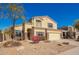 Inviting two-story home featuring a neutral color scheme, manicured landscaping, and an attached two-car garage at 1244 W Castle Dr, Casa Grande, AZ 85122