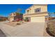 Inviting two-story home featuring a neutral color scheme, manicured landscaping, and an attached two-car garage at 1244 W Castle Dr, Casa Grande, AZ 85122