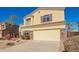 Inviting two-story home featuring a neutral color scheme, manicured landscaping, and an attached two-car garage at 1244 W Castle Dr, Casa Grande, AZ 85122