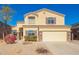 Inviting two-story home featuring a neutral color scheme, manicured landscaping, and an attached two-car garage at 1244 W Castle Dr, Casa Grande, AZ 85122