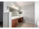 Double sink bathroom with large mirrors and tile floor at 1244 W Castle Dr, Casa Grande, AZ 85122