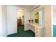 Dressing area featuring a vanity with a large mirror, drawers, and carpeted flooring at 13623 N 108Th Dr, Sun City, AZ 85351