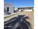 Exterior view of the property showing a white building and a concrete driveway at 1414 E Moreland St, Phoenix, AZ 85006