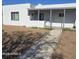 The home has a covered front porch with a xeriscaped front yard and a walkway at 1414 E Moreland St, Phoenix, AZ 85006