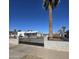 The home has a xeriscaped front yard and a dark gray horizontal metal fence around the perimeter at 1414 E Moreland St, Phoenix, AZ 85006