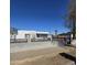 The home has a xeriscaped front yard and a gray block perimeter wall with a black fence on top at 1414 E Moreland St, Phoenix, AZ 85006