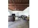 Living room with exposed wood ceiling, tile floors, television, fan, and gray sectional sofa at 1414 E Moreland St, Phoenix, AZ 85006