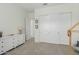 Bright and airy bedroom featuring a playhouse bed, white dresser, and closet storage at 14360 W Windrose Dr, Surprise, AZ 85379