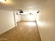 Spacious finished basement with tile flooring and recessed lighting, perfect for entertaining or recreation at 1440 E Grove Ave, Mesa, AZ 85204