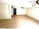 Large finished basement with neutral tile flooring, ideal for versatile living space at 1440 E Grove Ave, Mesa, AZ 85204