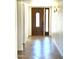 A hallway leading to a door with tile floors at 1440 E Grove Ave, Mesa, AZ 85204