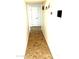 Hallway with decorative tile flooring leading to multiple doors at 1440 E Grove Ave, Mesa, AZ 85204