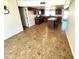 Large kitchen with an island, granite countertops, tile floors, and cabinets at 1440 E Grove Ave, Mesa, AZ 85204