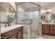 Beautifully renovated bathroom with a glass-enclosed shower and -and- vanities at 14728 W Cheery Lynn Dr, Goodyear, AZ 85395