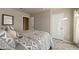 Cozy bedroom featuring a patterned quilt, and neutral-colored walls at 14728 W Cheery Lynn Dr, Goodyear, AZ 85395