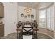 Cozy dining room featuring a stylish table set, pendant lighting, and decorative wall decor at 14728 W Cheery Lynn Dr, Goodyear, AZ 85395