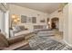 Spacious living room featuring comfortable couches, patterned rug, and modern decor at 14728 W Cheery Lynn Dr, Goodyear, AZ 85395