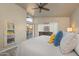 Tranquil main bedroom with natural light, tile floor and a view of the backyard at 14728 W Cheery Lynn Dr, Goodyear, AZ 85395