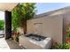 Relaxing backyard space featuring a water feature surrounded by lush landscaping at 14820 N 44Th Pl, Phoenix, AZ 85032