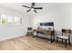 Bright, minimalist bedroom with a desk, neutral tones, and natural light at 14820 N 44Th Pl, Phoenix, AZ 85032