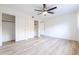 Spacious bedroom with plank flooring, modern ceiling fan and large closets at 14820 N 44Th Pl, Phoenix, AZ 85032