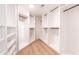 Walk-in closet featuring custom shelving and ample space for storage at 14820 N 44Th Pl, Phoenix, AZ 85032