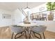 Bright dining room featuring modern table and chairs, plus view of the staircase at 14820 N 44Th Pl, Phoenix, AZ 85032