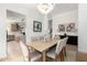 Stylish dining room featuring contemporary decor, a modern chandelier, and an open floor plan at 14820 N 44Th Pl, Phoenix, AZ 85032