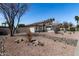 Charming single-story home with desert landscaping, creating a serene and low-maintenance front yard at 14820 N 44Th Pl, Phoenix, AZ 85032