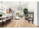 Bright living room featuring wood floors, high ceilings, and sliding glass doors to the patio at 14820 N 44Th Pl, Phoenix, AZ 85032