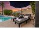 Backyard pool with two lounge chairs and a sunset view at 14820 N 44Th Pl, Phoenix, AZ 85032